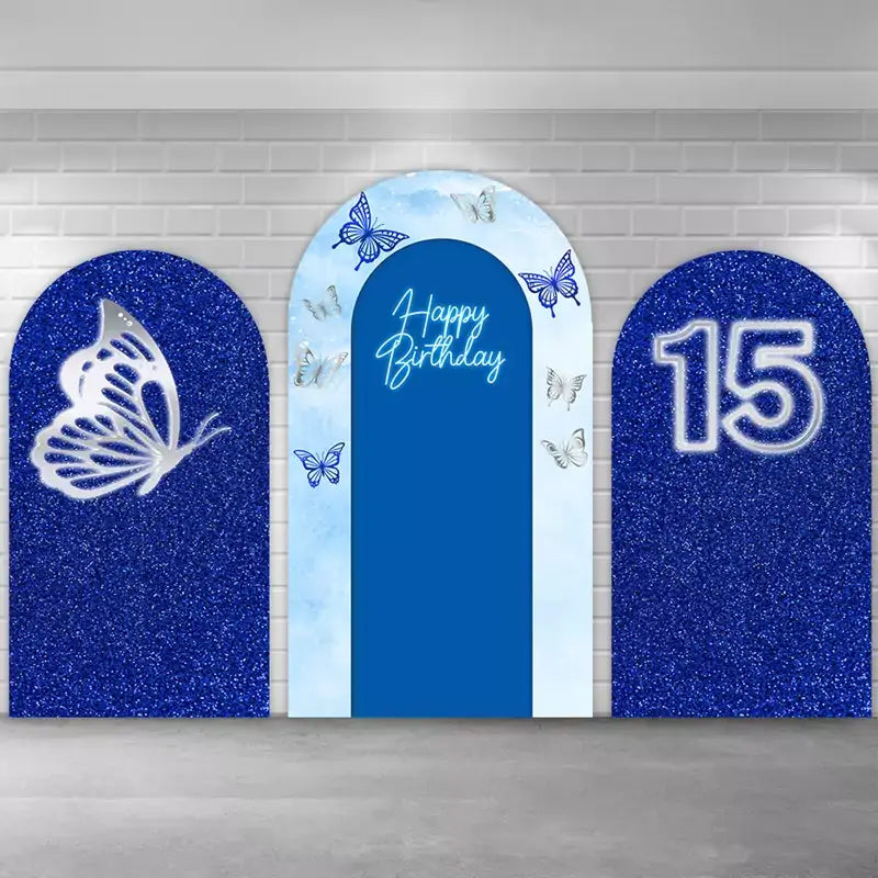 Elegant three-piece blue butterfly birthday arch backdrop set featuring sparkling blue glitter panels, a central ‘Happy Birthday’ arch with butterfly prints, and silver butterfly accents, perfect for 15th birthday or sweet sixteen party decorations