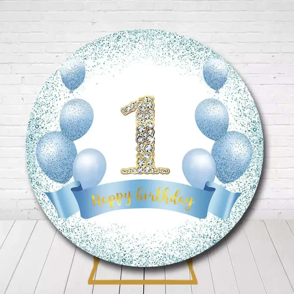 Blue and glittery 1st birthday backdrop featuring a sparkling "1" and blue balloons with a ribbon saying "Happy Birthday"