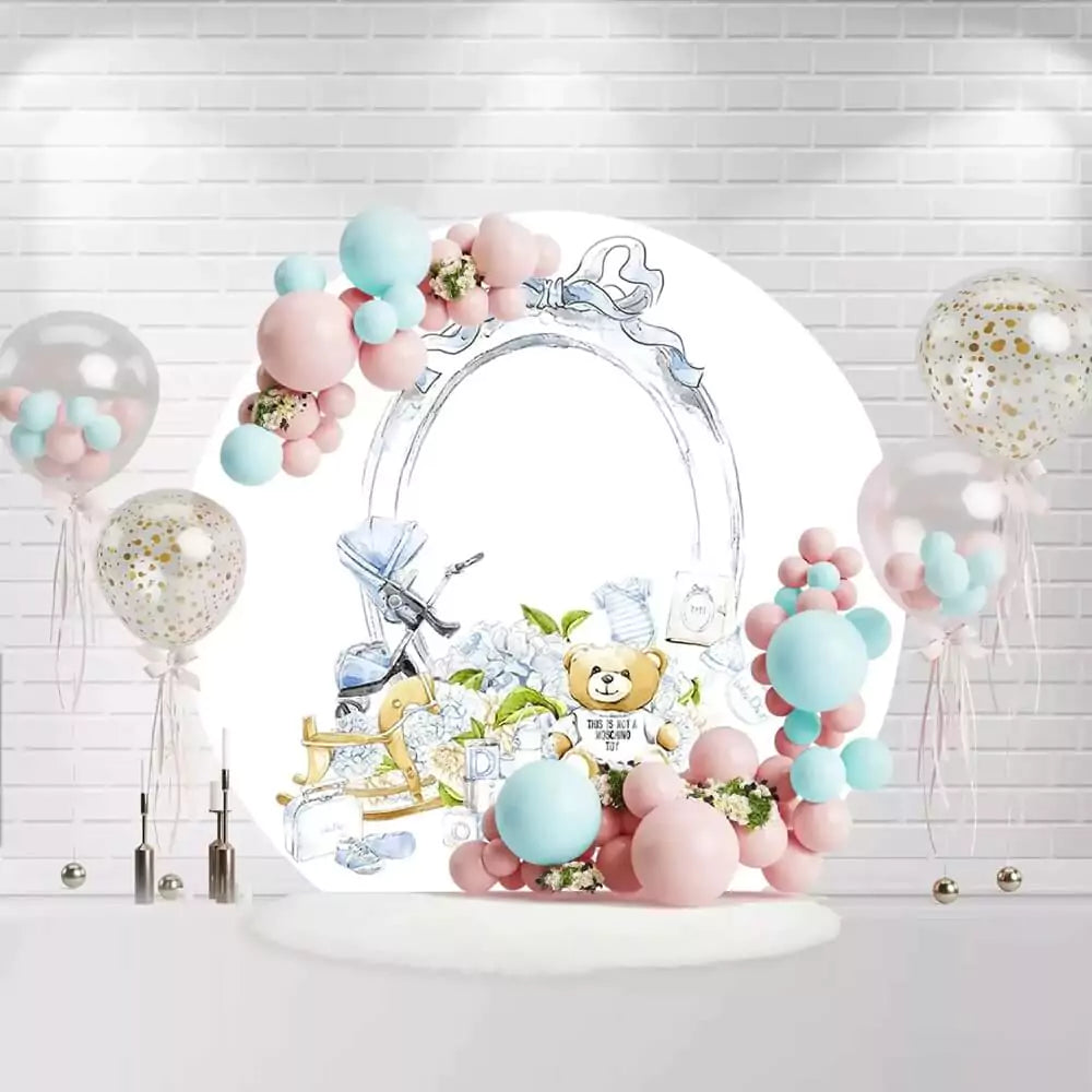 Round baby boy shower backdrop with teddy bear, rocking horse, and blue bow design