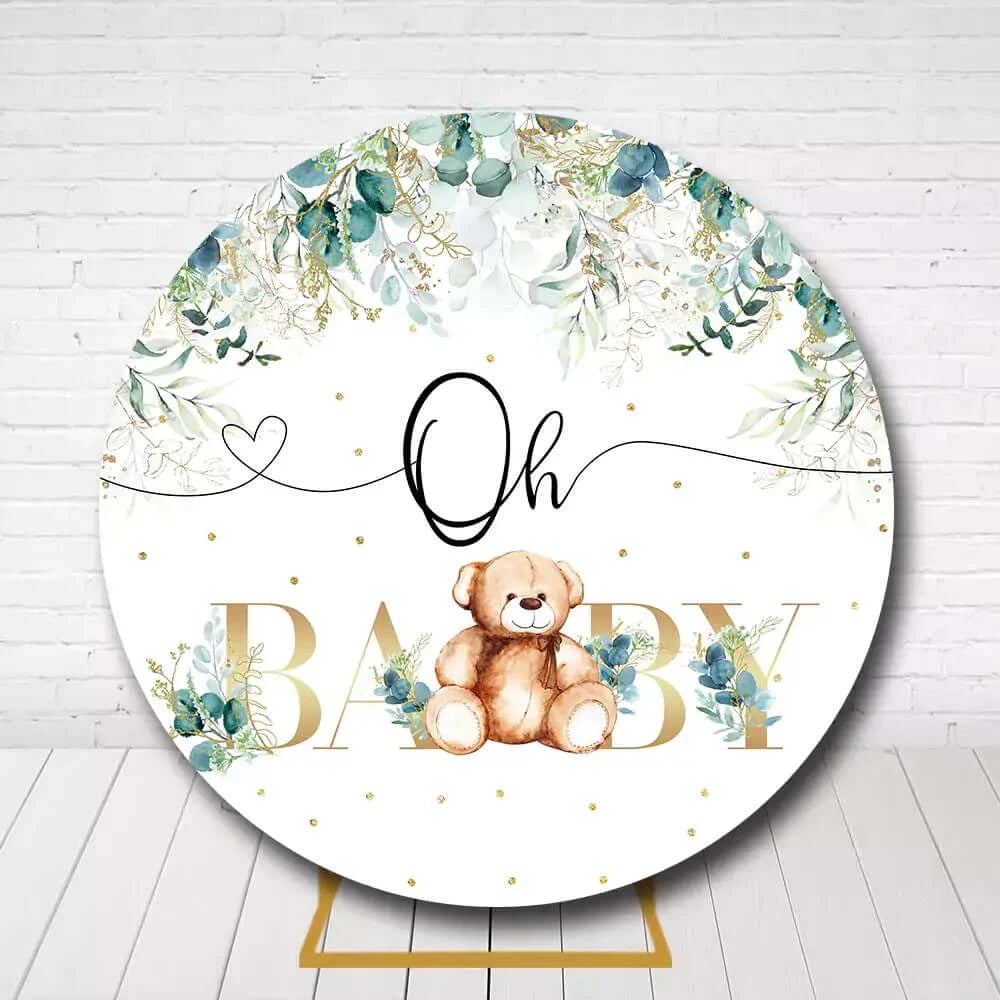 Oh Baby circle backdrop featuring teddy bear and eucalyptus leaves for newborn celebration