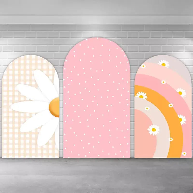 Pastel arch backdrop trio featuring a large daisy over gingham, a soft pink dotted middle panel, and a warm-toned rainbow with floral accents—perfect for spring, baby showers, or girly birthdays.