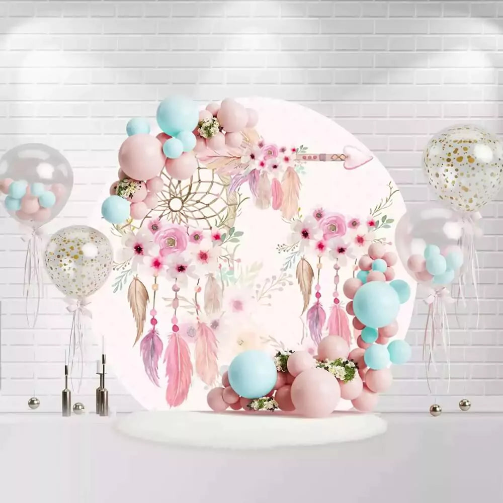 Round boho pink dreamcatcher backdrop with feathers, flowers, and arrow for baby girl party