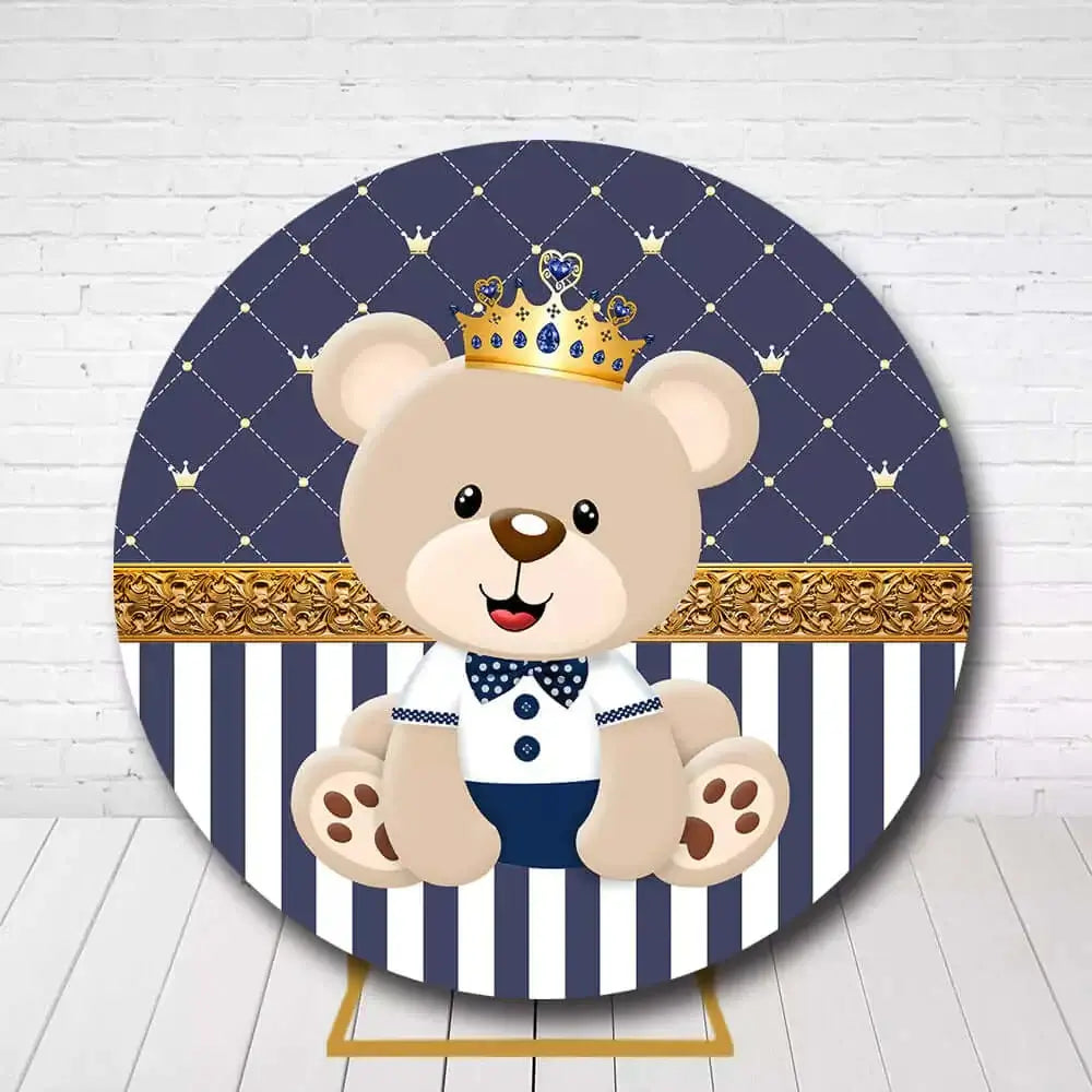 Baby boy’s birthday party backdrop featuring royal teddy bear in navy blue and gold