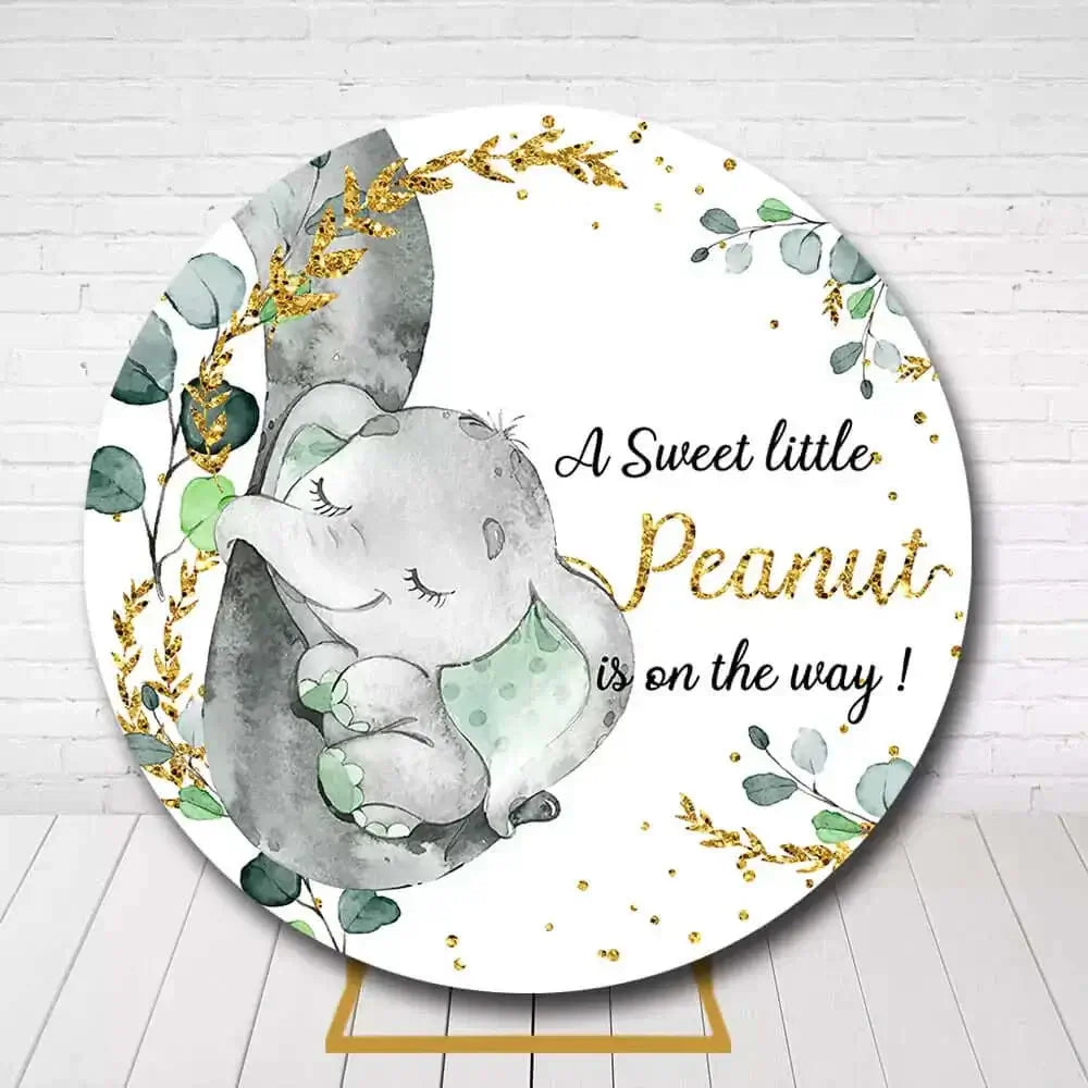 Circle backdrop featuring watercolor elephant, leaves, and gold for gender neutral baby shower