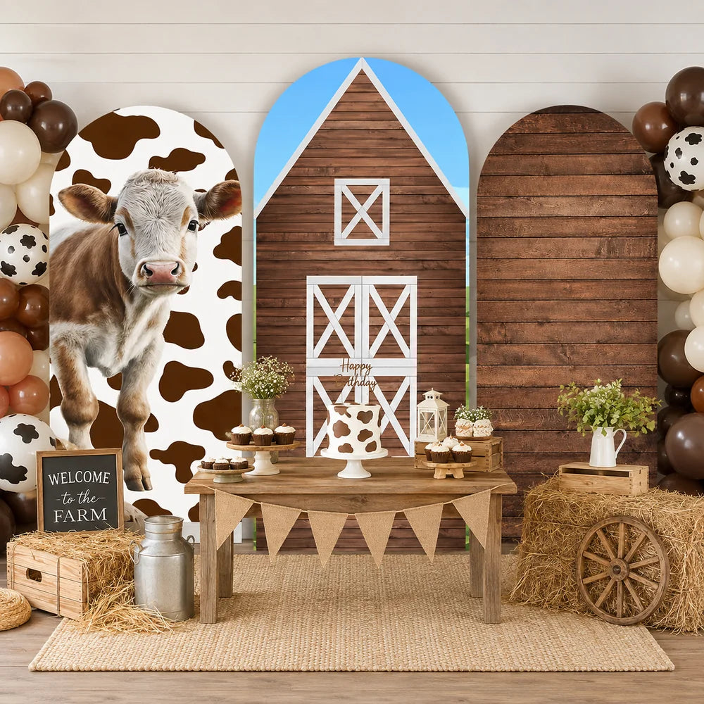 Farm party set with three arch backdrop covers featuring a realistic cow with cow print, a rustic wooden barn with white doors and a dark wood plank design.
