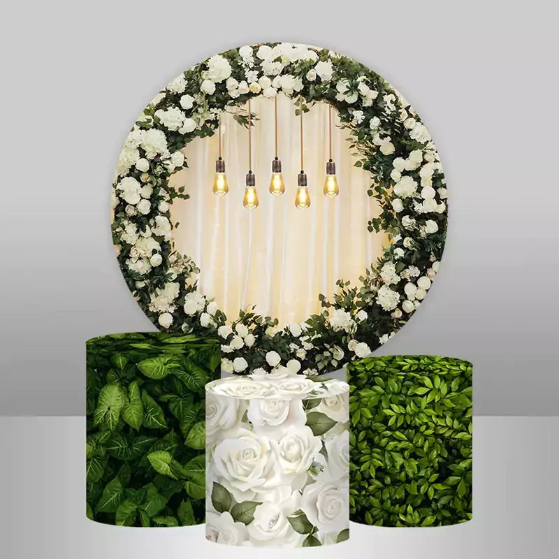 Round greenery and white rose backdrop with three matching leaf and rose cylinder covers