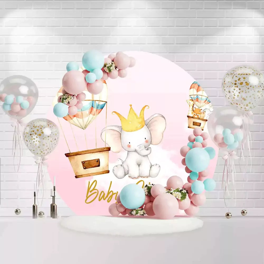 Cute baby girl circle backdrop featuring elephant with crown and pastel balloons for shower party decoration
