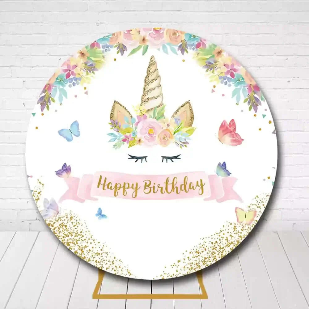 Whimsical unicorn circle backdrop featuring flowers, golden horn, and "Happy Birthday" banner