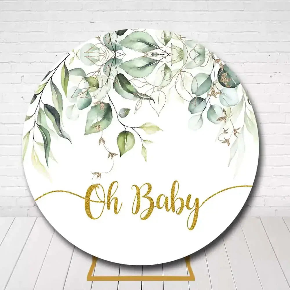 Circle baby shower backdrop featuring watercolor leaves and Oh Baby text in gold