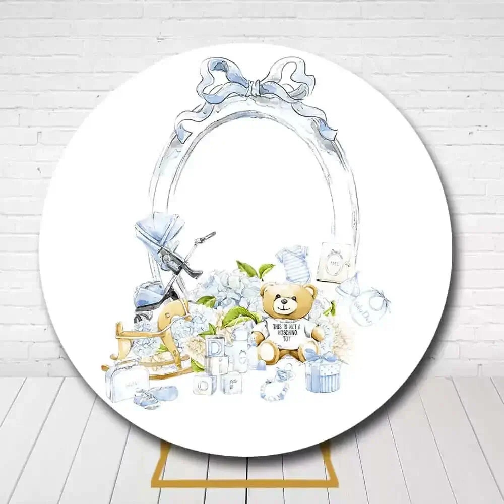 Adorable newborn celebration circle backdrop with teddy, baby blocks, and pastel blue accents
