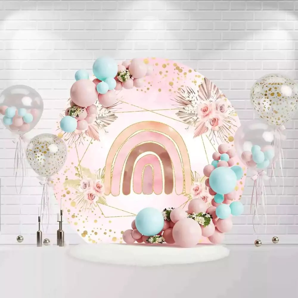 Pink and gold rainbow backdrop for a birthday party, featuring boho floral design and soft pink tones