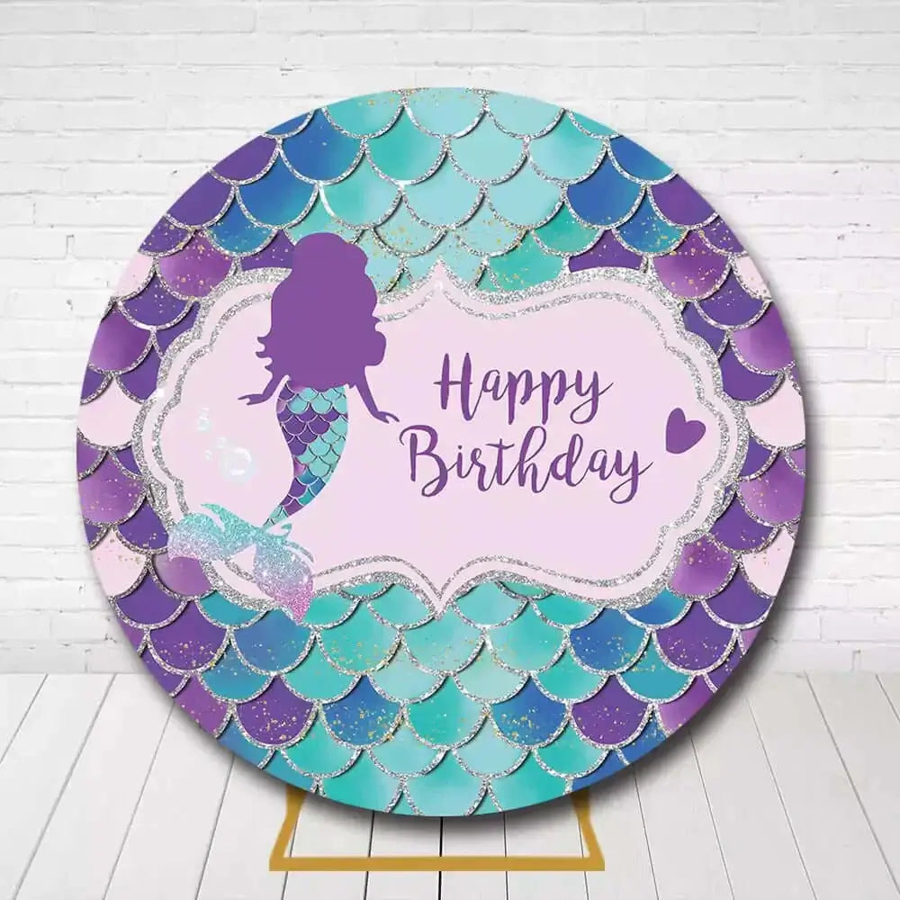 Whimsical mermaid birthday backdrop featuring purple, teal, and pink glitter scales