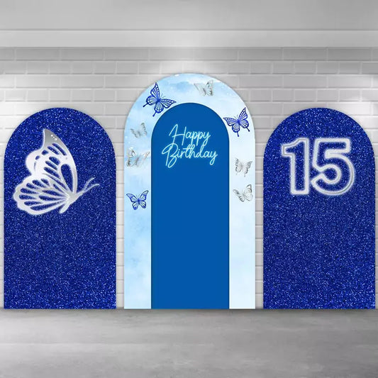 Elegant three-piece blue butterfly birthday arch backdrop set featuring sparkling blue glitter panels, a central ‘Happy Birthday’ arch with butterfly prints, and silver butterfly accents, perfect for 15th birthday or sweet sixteen party decorations