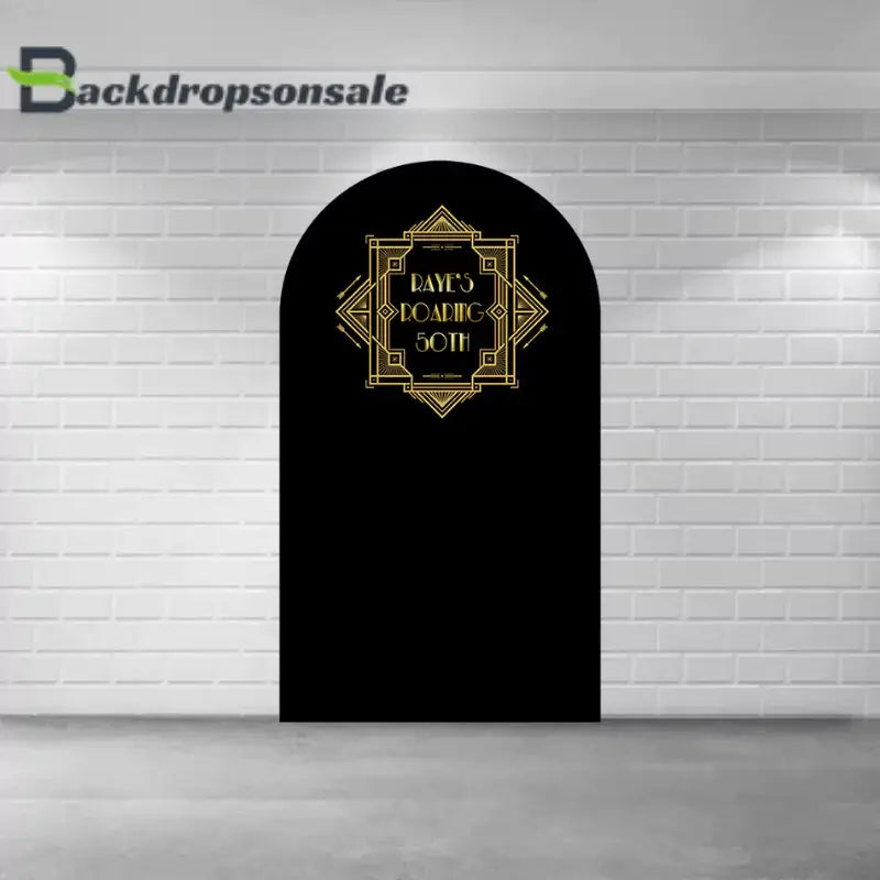 Center arch panel of the Art Deco backdrop set with black and gold detailing and the text "Raye's Roaring 50th."