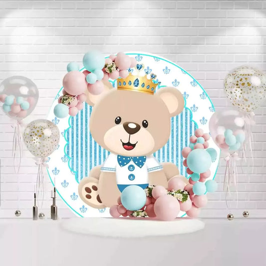Round baby bear baptism backdrop with crown, blue stripes, and floral accents