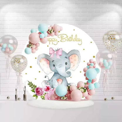 Round baby elephant birthday backdrop with pink bow, flowers, and gold glitter
