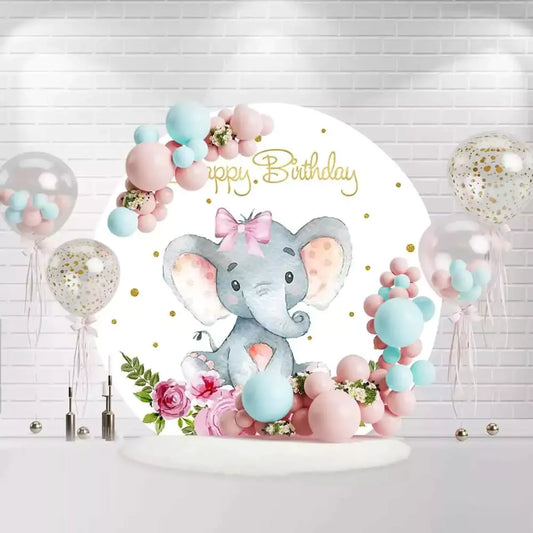Round baby elephant birthday backdrop with pink bow, flowers, and gold glitter