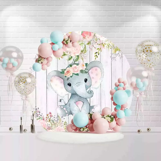 Round baby elephant birthday backdrop with floral crown and pink flowers