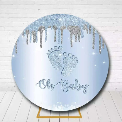 Oh Baby themed backdrop with glitter footprints and silver dripping effect for baby shower
