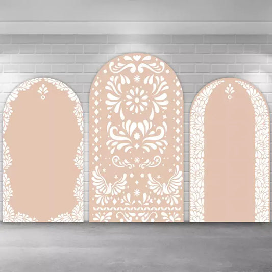 Neutral-toned arch backdrop set featuring intricate white lace-inspired floral motifs on beige background, ideal for boho-themed weddings, photo shoots, or modern event decor.