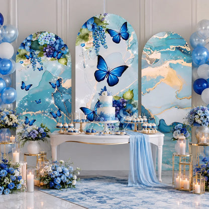 Elegant blue butterfly party set with three arch backdrop covers featuring vivid blue butterflies, blue floral arrangements and watercolor marble patterns with gold accents.