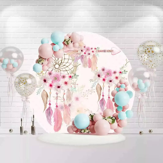 Round boho pink dreamcatcher backdrop with feathers, flowers, and arrow for baby girl party