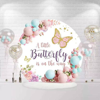 Round butterfly gender reveal backdrop with pink and purple flowers and butterfly design
