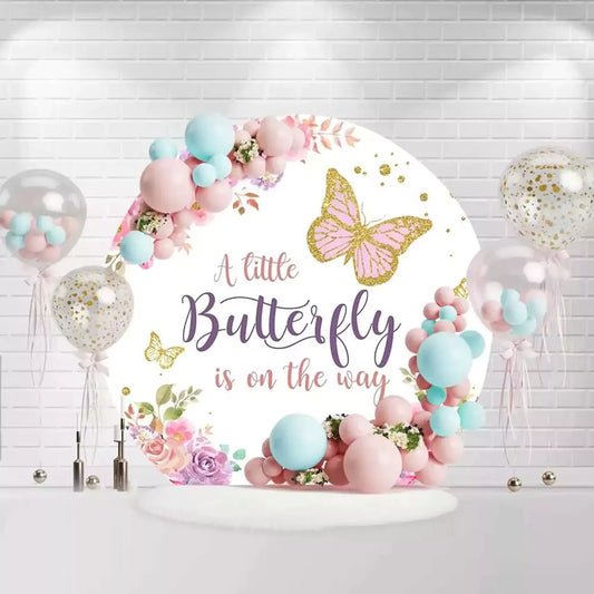 Round butterfly gender reveal backdrop with pink and purple flowers and butterfly design