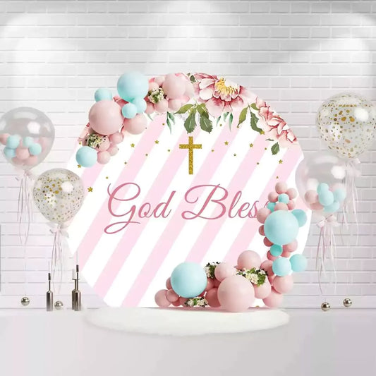 Round God Bless backdrop with pink stripes, flowers, and golden cross for baptism or christening