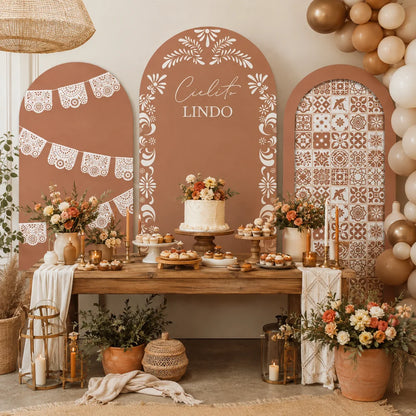 Warm boho Mexican party set with three arch backdrop covers featuring white papel picado lace details, Cielito Lindo lettering, folk floral motifs and decorative tile patterns.