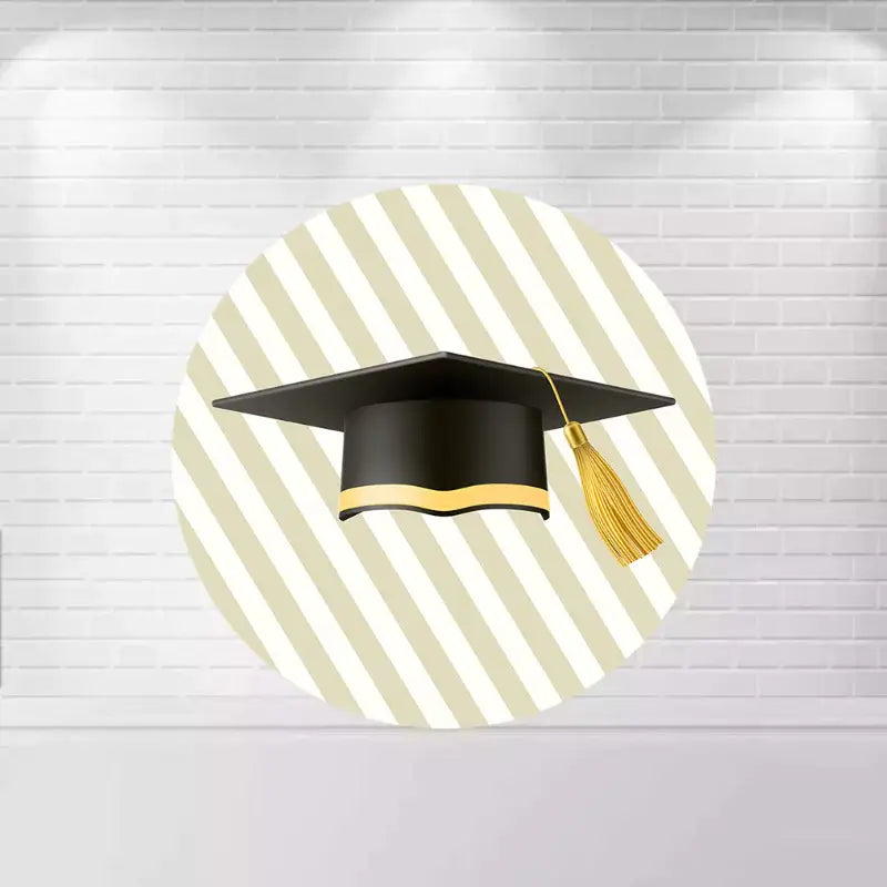 Round backdrop with a large graduation cap design on a striped background, perfect for graduation parties.