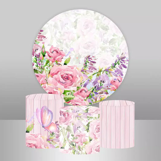 Round floral backdrop with pink and purple flowers match three cylinder covers with flowers, butterfly and stripe.