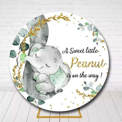 Circle backdrop featuring watercolor elephant, leaves, and gold for gender neutral baby shower