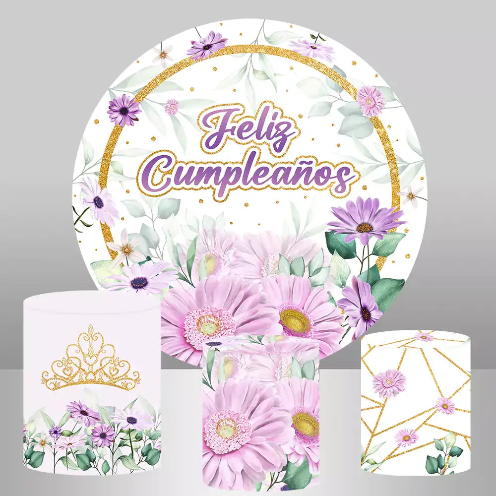 Round "Feliz Cumpleaños" floral backdrop with purple flowers and three cylinder covers featuring a crown, floral, and geometric designs