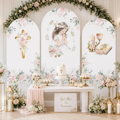 First Communion girl party set with three arch backdrop covers featuring a praying girl, floral gold cross, chalice, candle, Bible and soft pink watercolor flowers.