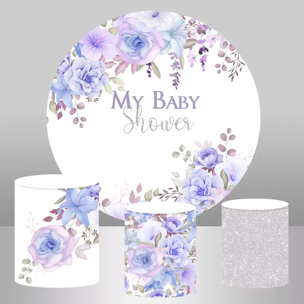 Circular baby shower backdrop with purple floral design and three matching columns