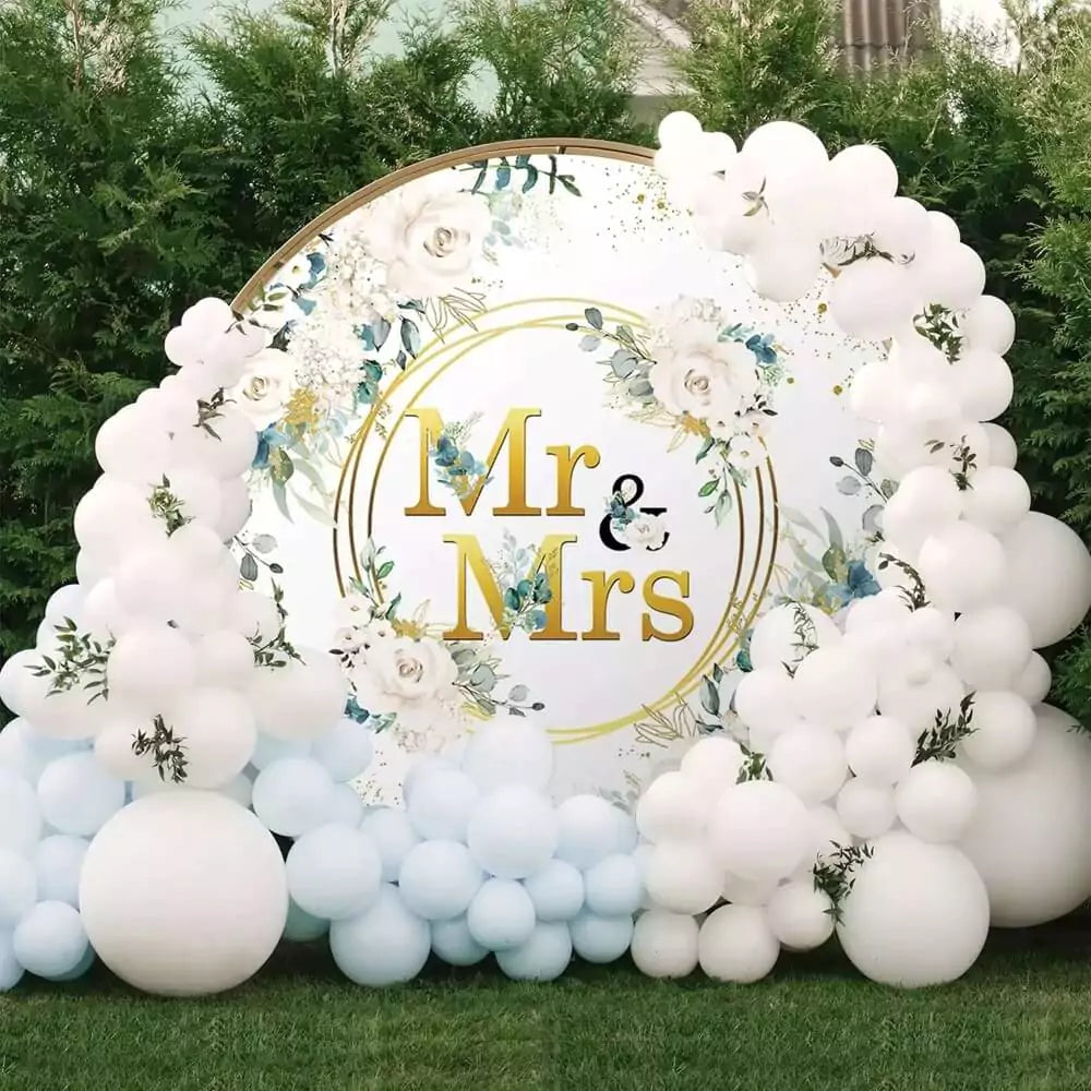 Luxury wedding backdrop with Mr & Mrs text, flowers, and gold accents