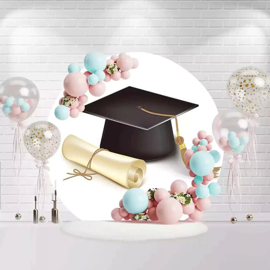 Round graduation backdrop with black cap, golden tassel, and diploma scroll