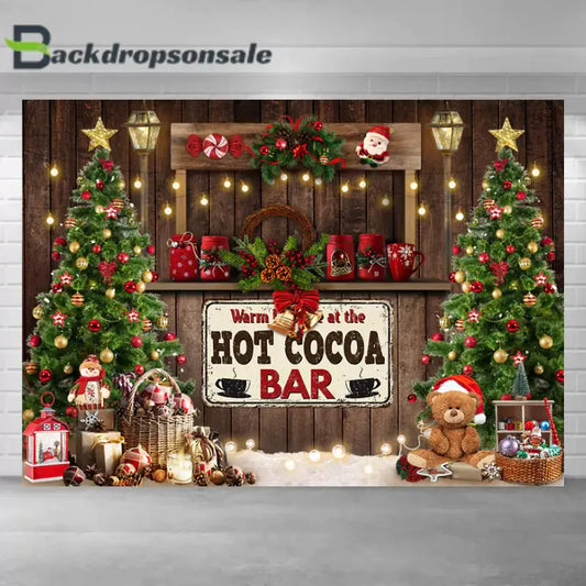Festive Christmas backdrop featuring a hot cocoa bar, Christmas trees, and holiday decorations