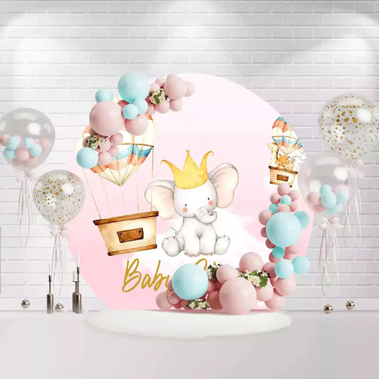 Cute baby girl circle backdrop featuring elephant with crown and pastel balloons for shower party decoration