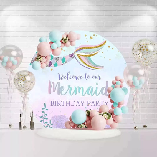 Round mermaid birthday backdrop with glittering mermaid tail and pastel scales