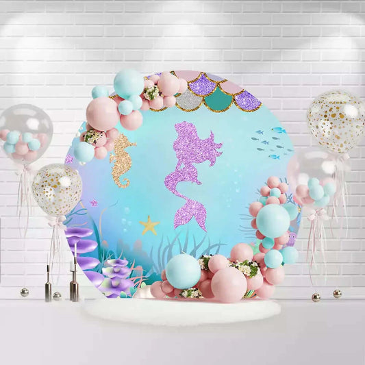 Round mermaid backdrop with glitter silhouette, seahorse, treasure chest, and coral reef
