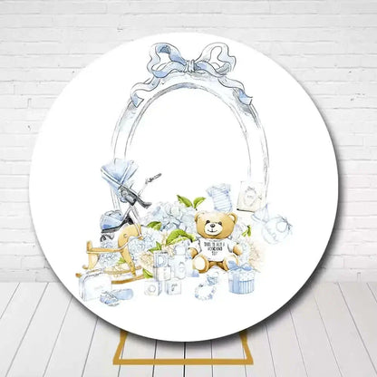 Adorable newborn celebration circle backdrop with teddy, baby blocks, and pastel blue accents