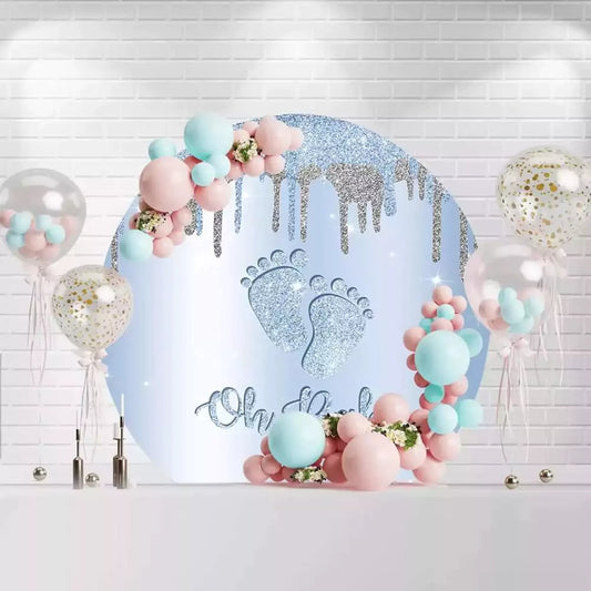 Elegant baby shower backdrop in blue with sparkling silver glitter accents and baby feet design