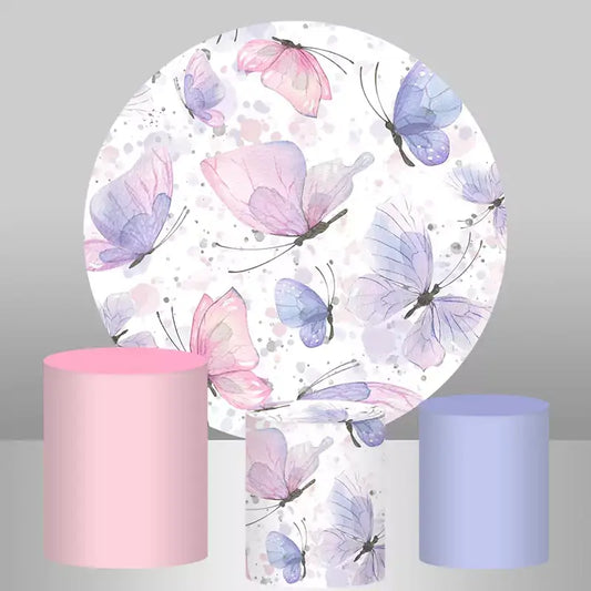 Round pastel butterfly backdrop with three matching pink and purple cylinder covers for party decor