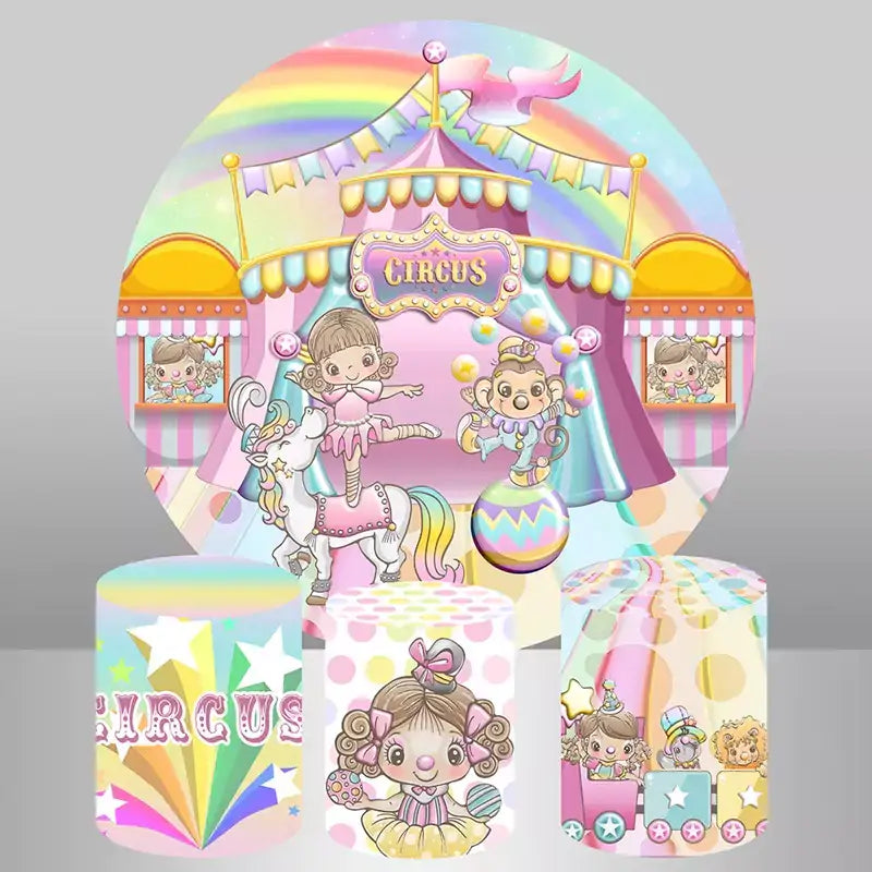 A pastel circus-themed party decor set featuring a round backdrop with a whimsical circus tent and three matching cylinder covers with rainbow, starburst, and carnival train designs.