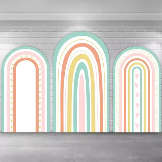 Charming 3-piece pastel rainbow backdrop set featuring soft pink, blue, yellow, and green rainbow arches with decorative accents like hearts and patterns, perfect for children’s birthday parties or themed baby showers.