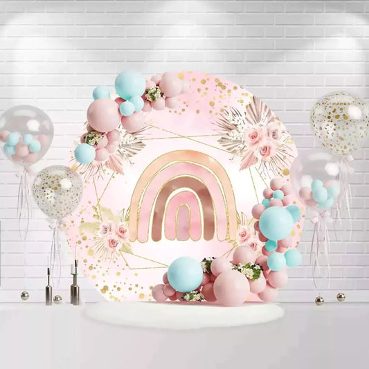 Pink and gold rainbow backdrop for a birthday party, featuring boho floral design and soft pink tones