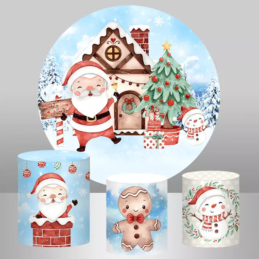 Christmas-themed decor set featuring a round backdrop with Santa, a gingerbread house, a Christmas tree, and a snowman, paired with cylinder covers of Santa in a chimney, a gingerbread man, and a snowman with holly.