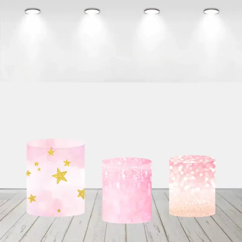 Set of three pink cylinder covers with gold stars and glittery designs